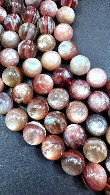 Natural lepidolite mica gemstone beads . Gorgeous natural rainbow flash lepidolite bead. Excellent quality . Full strand 15.5”