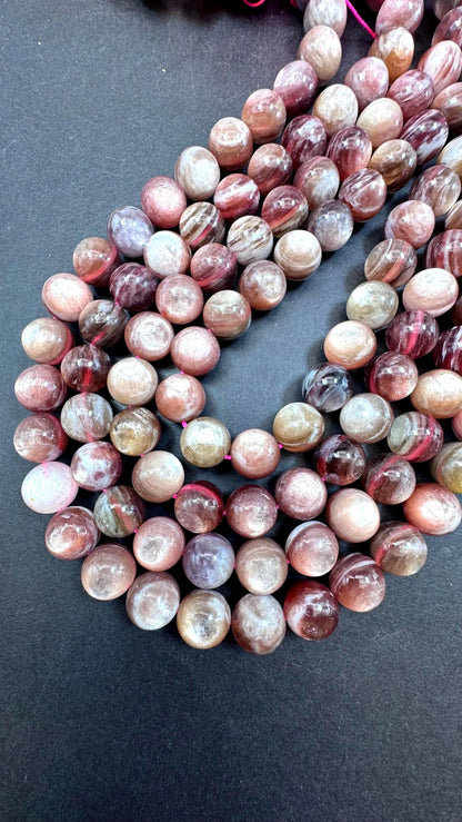 Natural lepidolite mica gemstone beads . Gorgeous natural rainbow flash lepidolite bead. Excellent quality . Full strand 15.5”