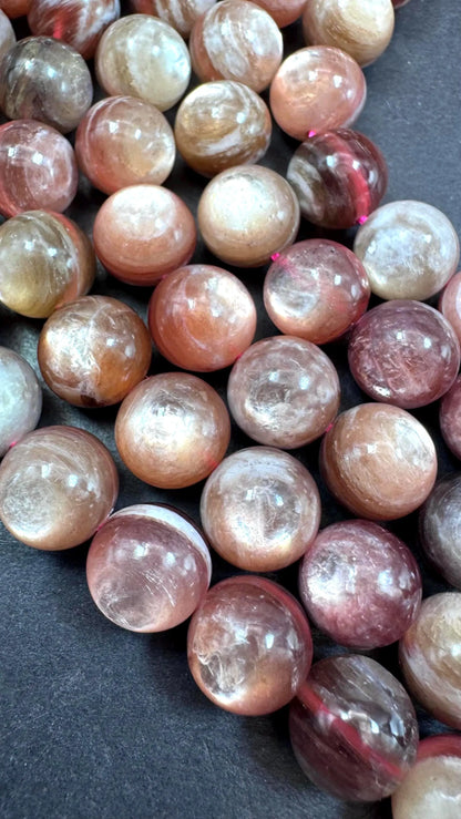 Natural lepidolite mica gemstone beads . Gorgeous natural rainbow flash lepidolite bead. Excellent quality . Full strand 15.5”