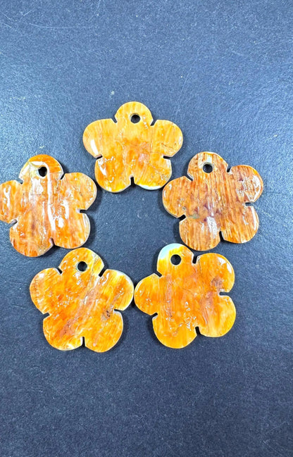 Natural spiny oyster shell pendant . Flower shape . Gorgeous Natural spiny oyster shell pendants . Natural orange yellow color . Not treated