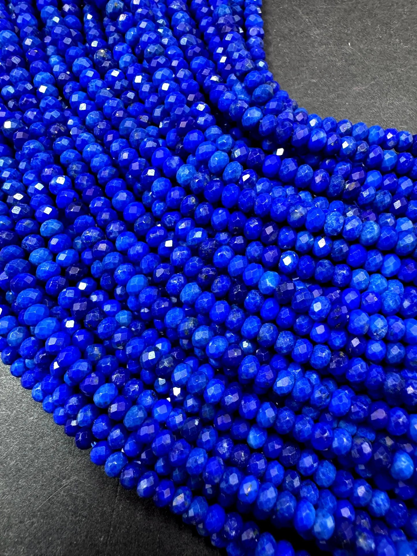 100% AAA Natural lapis lazuli 2x4mm gemstone. Faceted rondelle bead. Natural blue color. not treated . excellent quality .full strand 15.5