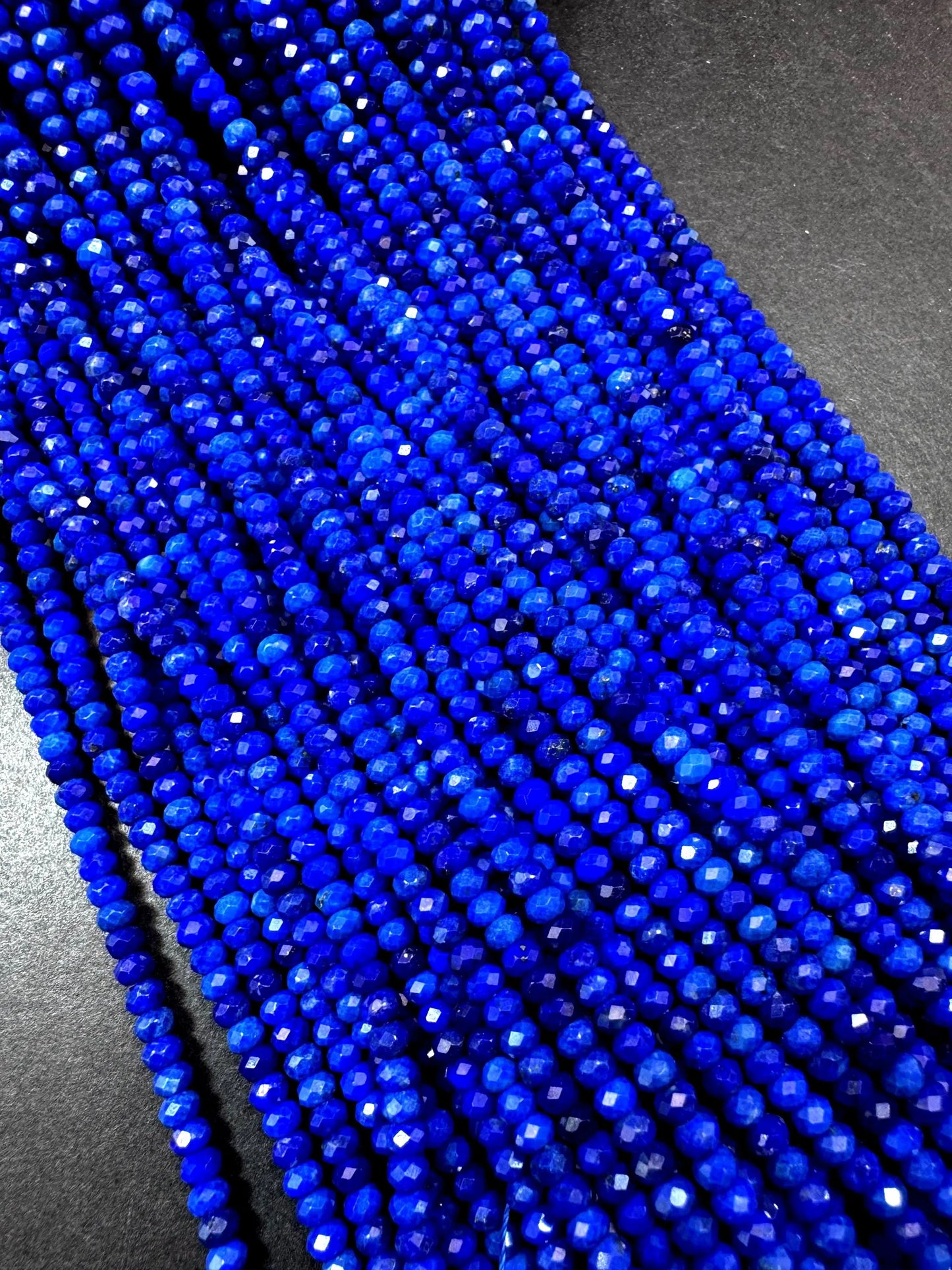 100% AAA Natural lapis lazuli 2x4mm gemstone. Faceted rondelle bead. Natural blue color. not treated . excellent quality .full strand 15.5