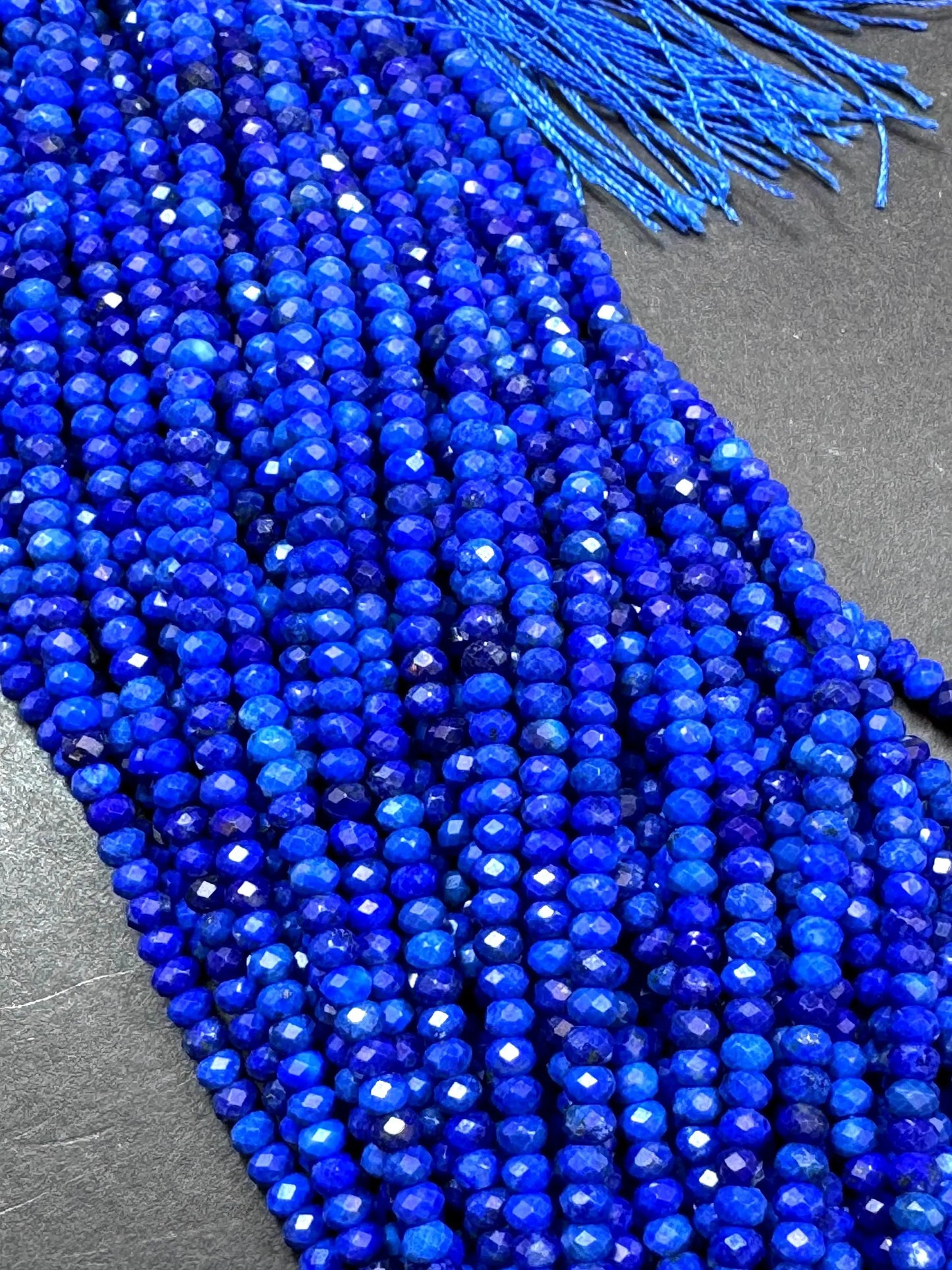 100% AAA Natural lapis lazuli 2x4mm gemstone. Faceted rondelle bead. Natural blue color. not treated . excellent quality .full strand 15.5
