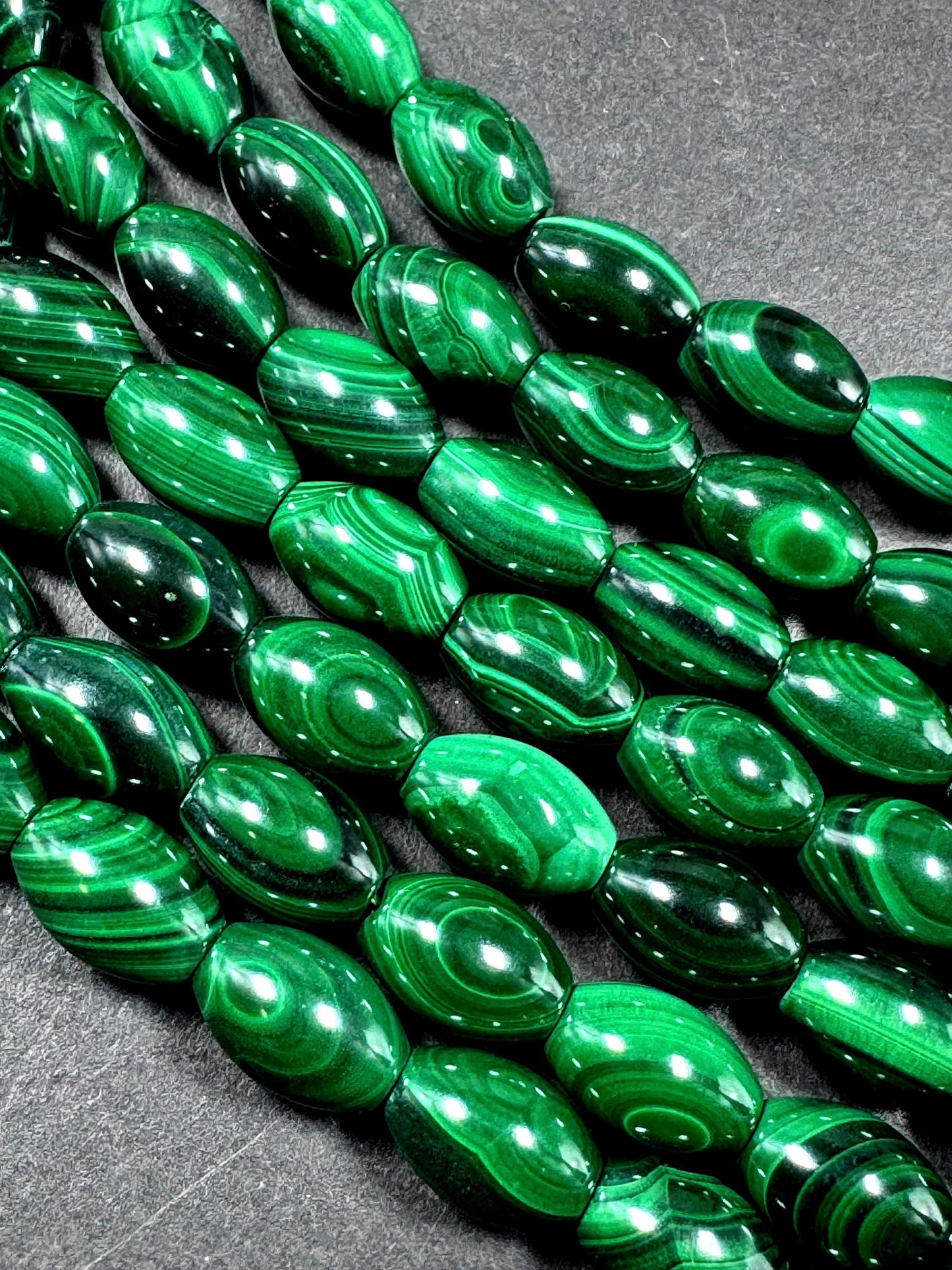 AAA Natural Malachite gemstone bead. Barrel shape. Beautiful Natural Green color. Great quality. Full strand 15.5"