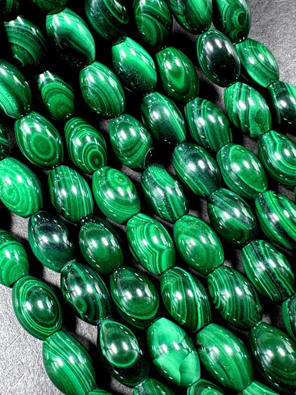 AAA Natural Malachite gemstone bead. Barrel shape. Beautiful Natural Green color. Great quality. Full strand 15.5"