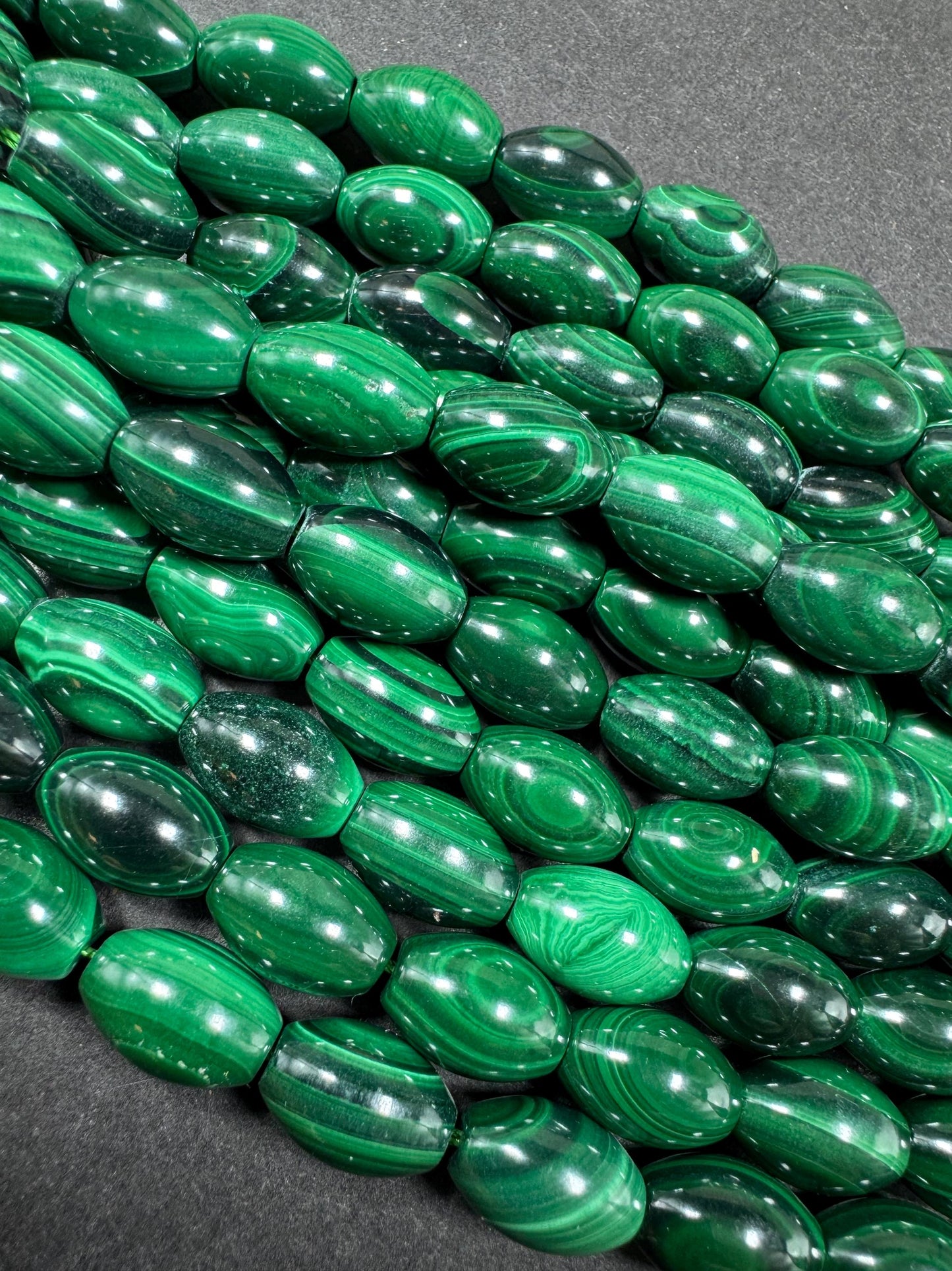 AAA Natural Malachite gemstone bead. Barrel shape. Beautiful Natural Green color. Great quality. Full strand 15.5"