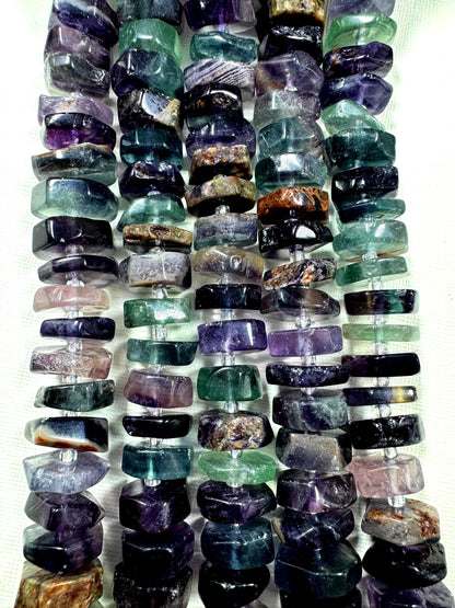 Natural fluorite gemstone beads. pinwheel shape . gorgeous natural color. not treated . excellent quality. full strand 15.5”