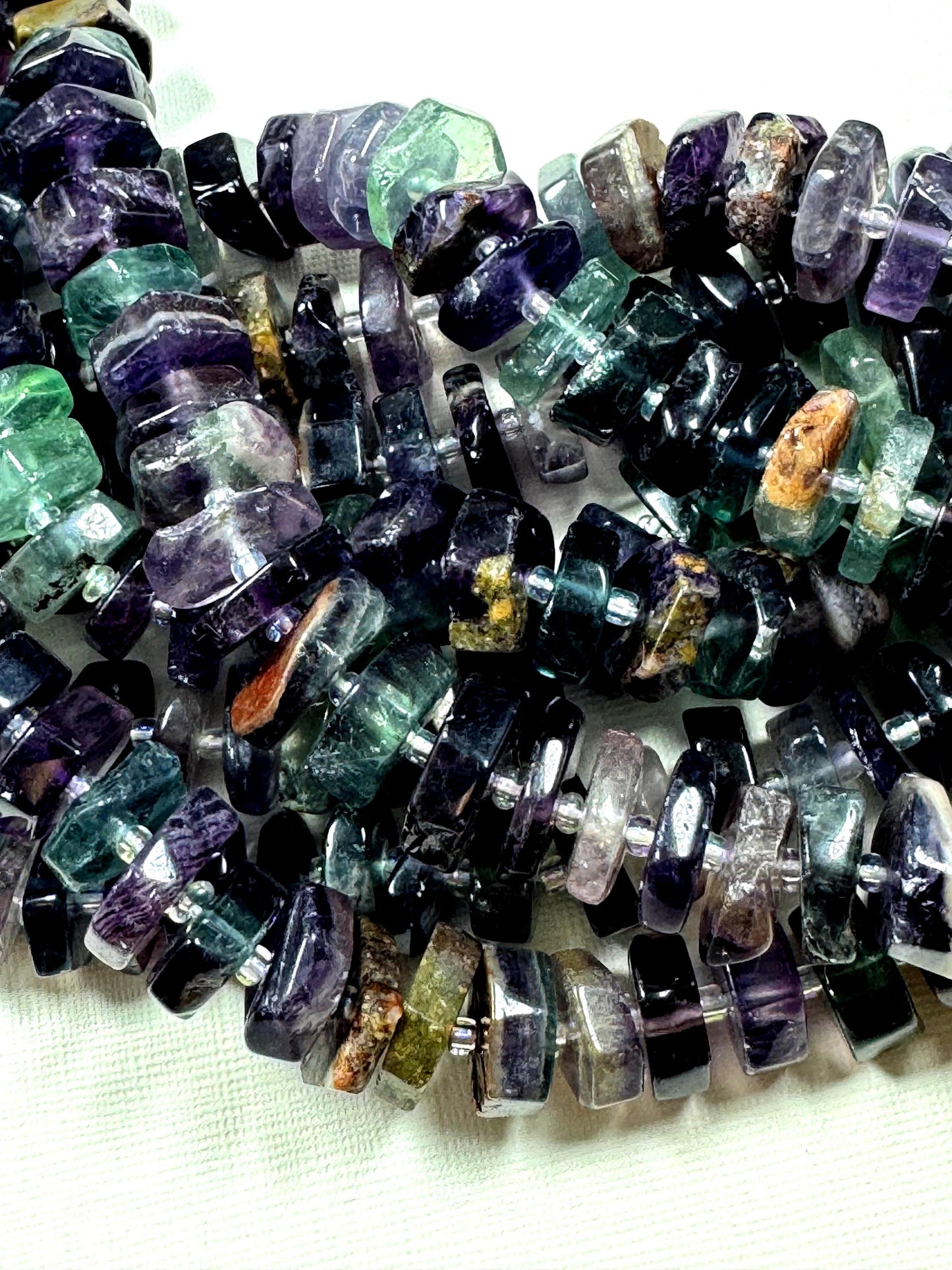 Natural fluorite gemstone beads. pinwheel shape . gorgeous natural color. not treated . excellent quality. full strand 15.5”