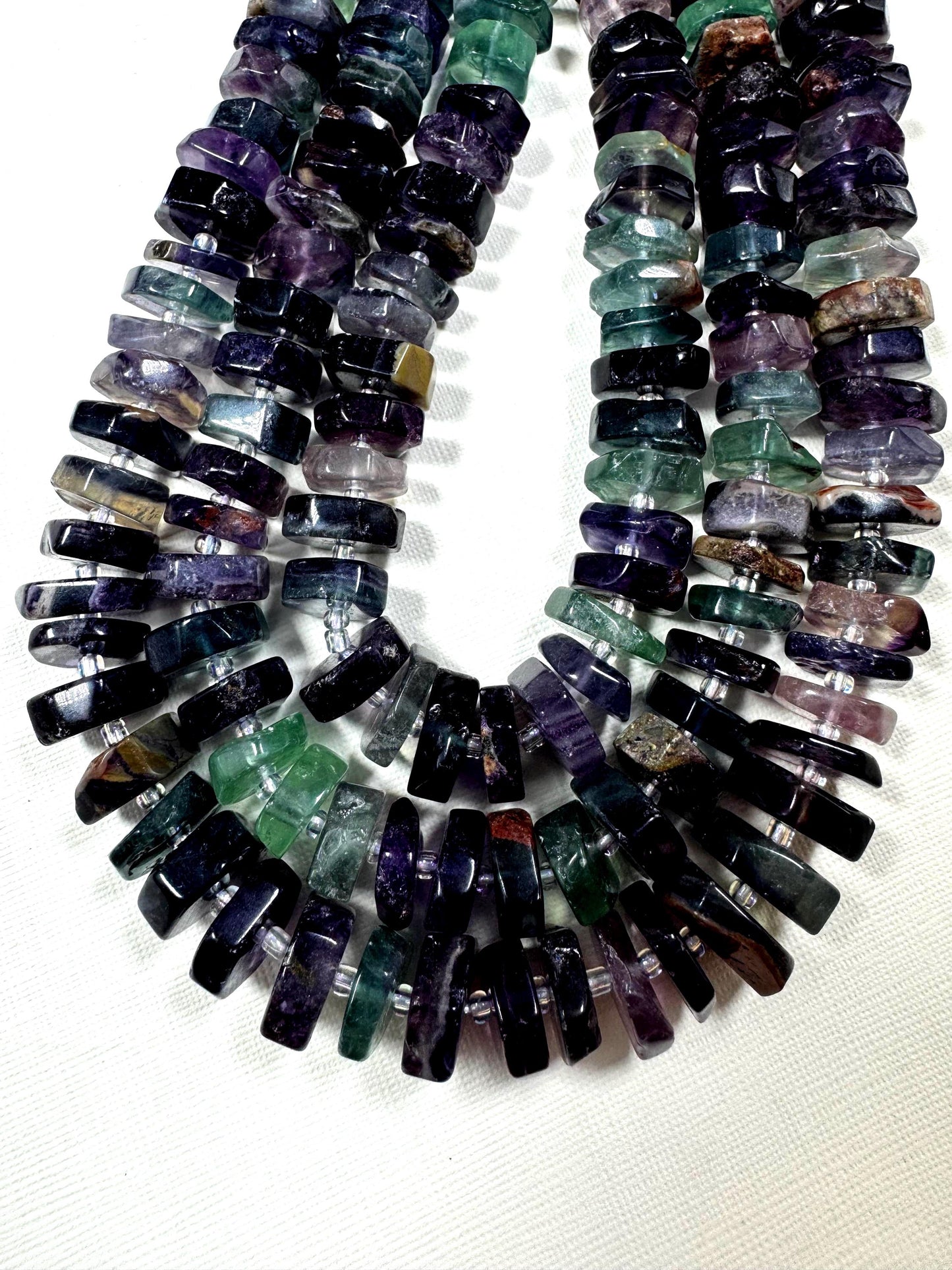 Natural fluorite gemstone beads. pinwheel shape . gorgeous natural color. not treated . excellent quality. full strand 15.5”
