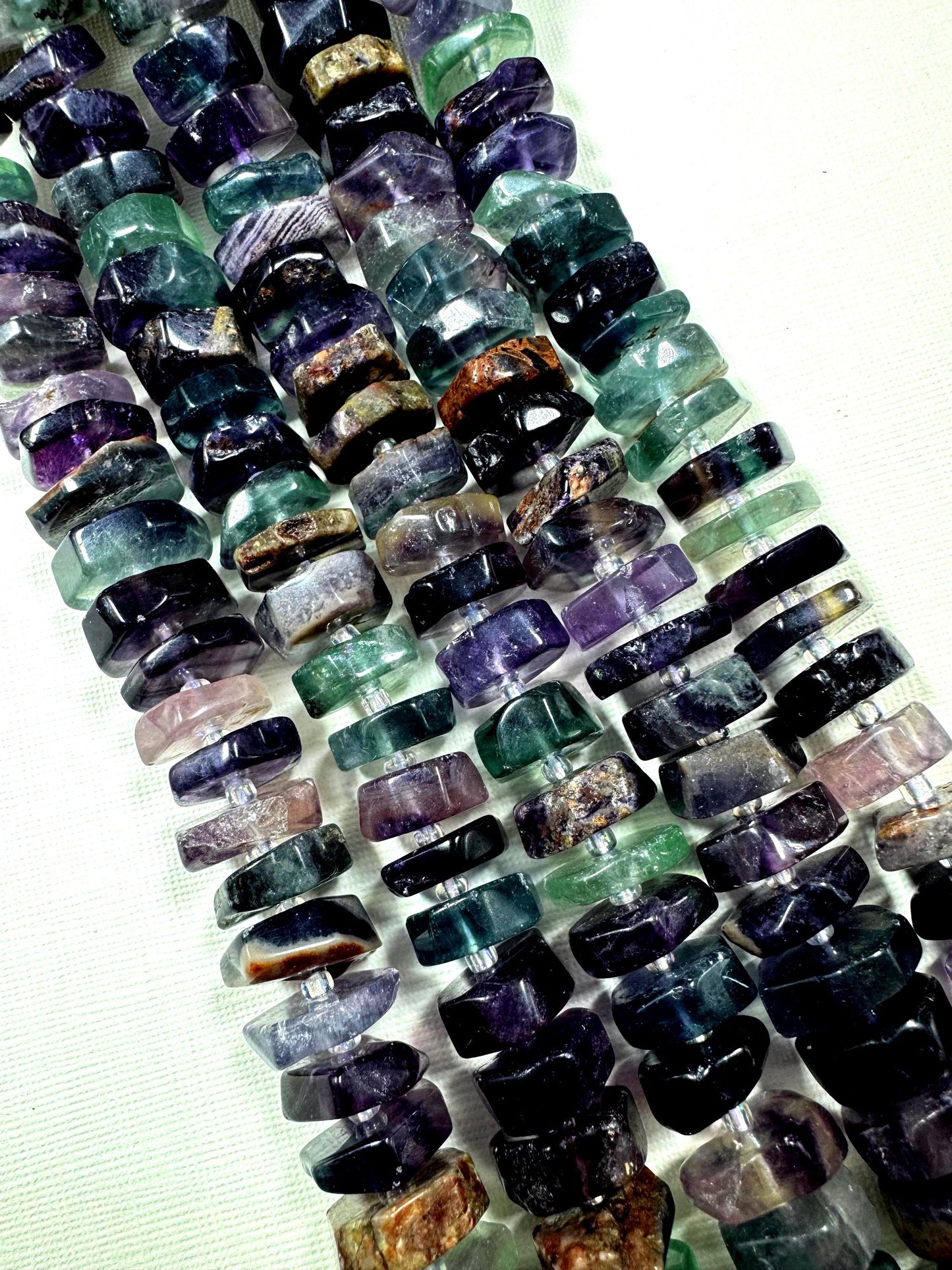 Natural fluorite gemstone beads. pinwheel shape . gorgeous natural color. not treated . excellent quality. full strand 15.5”