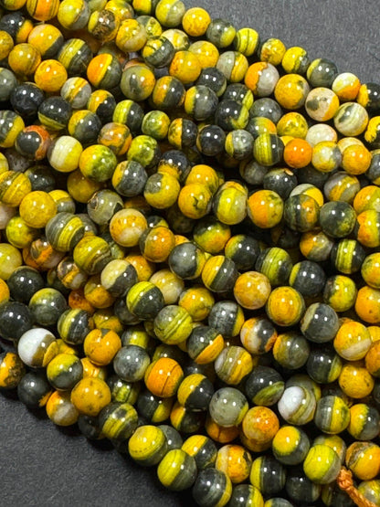 Natural yellow Jasper gemstone bead. smooth round shape . gorgeous natural yellow black color Jesper bead. excellent quality.full strand 15.