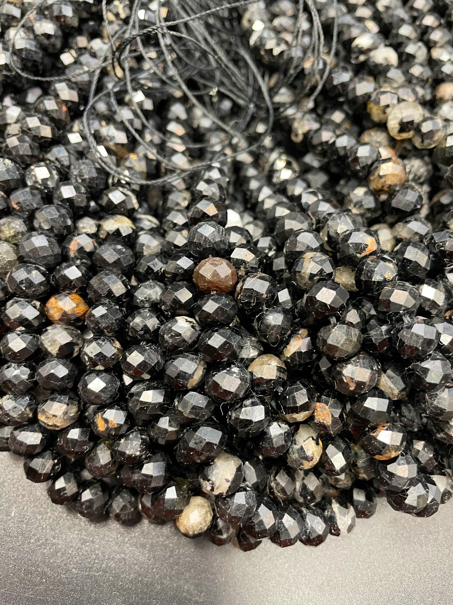 AAA Natural black Tourmaline bead. Faceted 5x8mm Roundell Shape. Gorgeous natural black color turmaline bead. Unique looking gemstone bead!